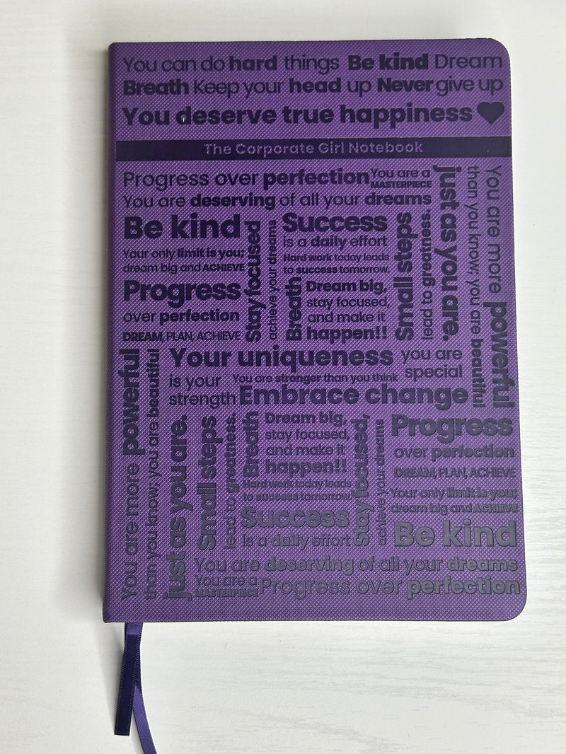 Purple A5 notebook with holographic edges and embossed cover with positive affirmations. Bulleted paper with pocket on the back.