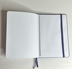 Purple A5 notebook with holographic edges and embossed cover with positive affirmations. Bulleted paper with pocket on the back.