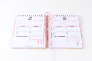 The Corporate Girl Daily Planner Undated, with stickers, meeting notes, daily dockets, birthdays to remember, notes section and a budget section. 